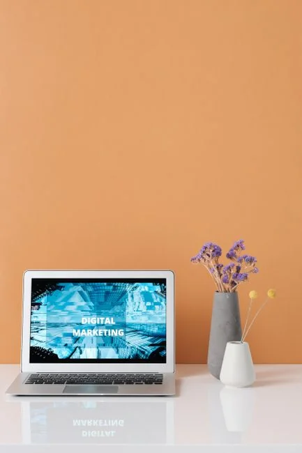 A flat lay of branding elements with color palettes and strategic planning documents on a concrete surface.